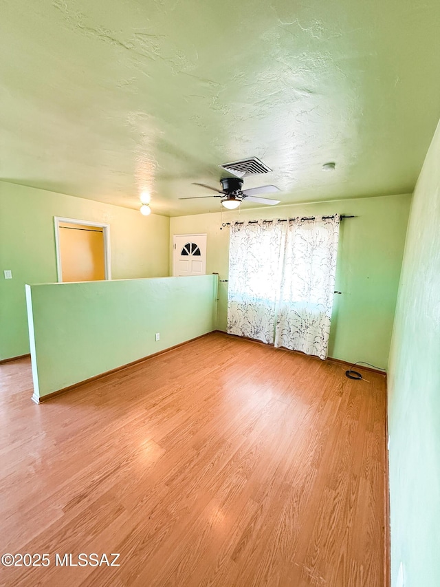 1350 E Goosetree Ln, Safford, AZ 85546 - empty room with a ceiling fan, light wood-type flooring, and visible vents