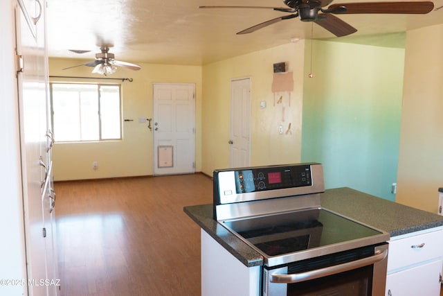 1350 E Goosetree Ln, Safford, AZ 85546 - kitchen featuring dark countertops, a ceiling fan, wood finished floors, and stainless steel range with electric stovetop