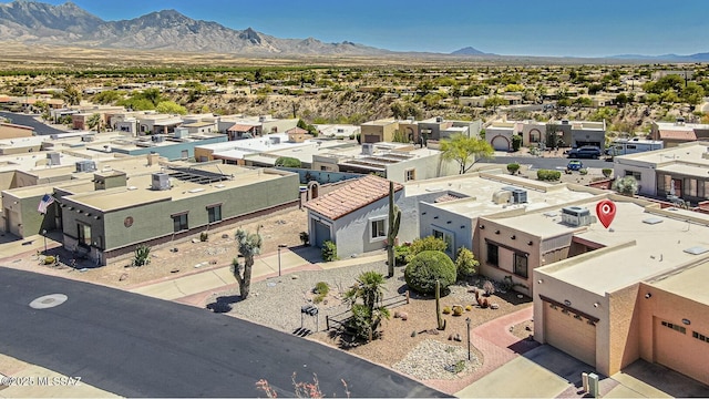birds eye view of property with a residential view and a mountain view