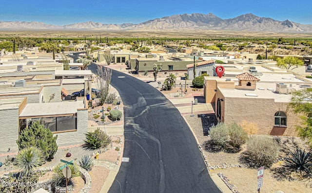 drone / aerial view featuring a mountain view and a residential view