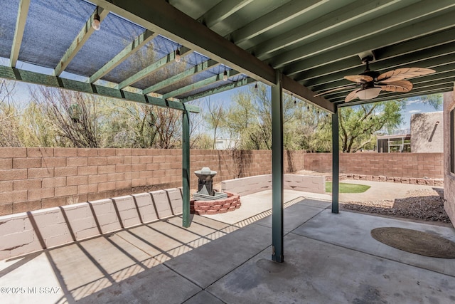 view of patio with a fenced backyard, a ceiling fan, and a pergola