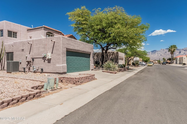exterior space with a mountain view and sidewalks