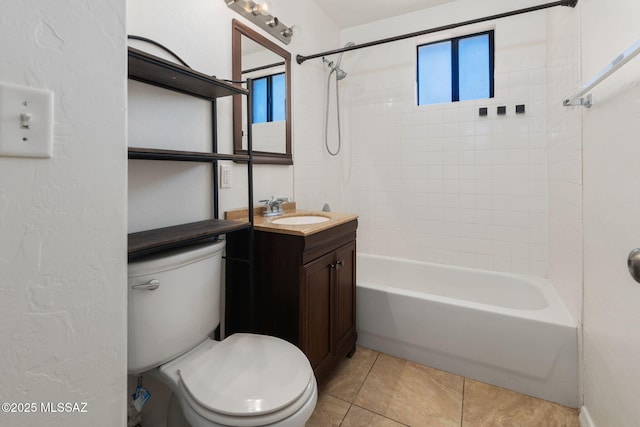 bathroom with tile patterned floors, toilet, tub / shower combination, and vanity