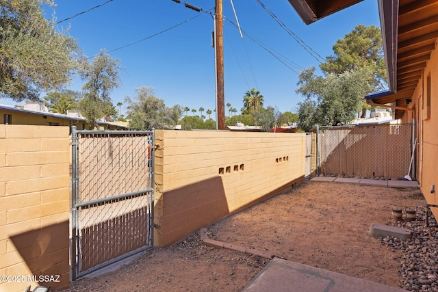 view of yard featuring a gate and fence
