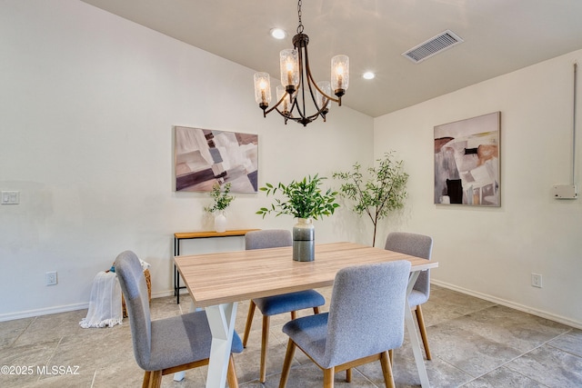 4921 N Boyd Ln, Tucson, AZ 85750 - dining space featuring baseboards, lofted ceiling, a chandelier, and visible vents