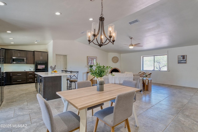 4921 N Boyd Ln, Tucson, AZ 85750 - dining area with ceiling fan with notable chandelier, recessed lighting, baseboards, vaulted ceiling, and visible vents