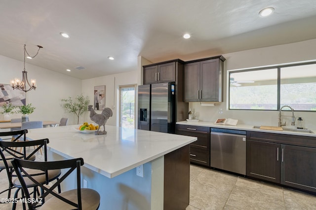 4921 N Boyd Ln, Tucson, AZ 85750 - kitchen with plenty of natural light, a sink, dark brown cabinetry, and stainless steel appliances