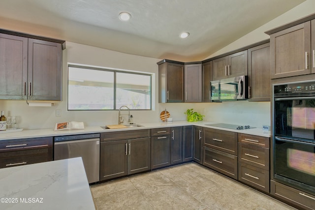 4921 N Boyd Ln, Tucson, AZ 85750 - kitchen with dark brown cabinets, a sink, black appliances, lofted ceiling, and recessed lighting