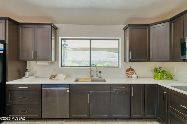 4921 N Boyd Ln, Tucson, AZ 85750 - kitchen featuring a sink, light countertops, stainless steel appliances, and dark brown cabinets