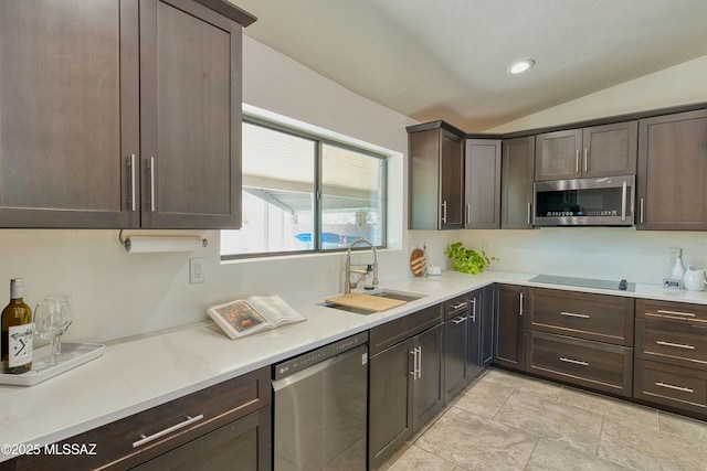 4921 N Boyd Ln, Tucson, AZ 85750 - kitchen featuring dark brown cabinets, light countertops, a sink, lofted ceiling, and stainless steel appliances
