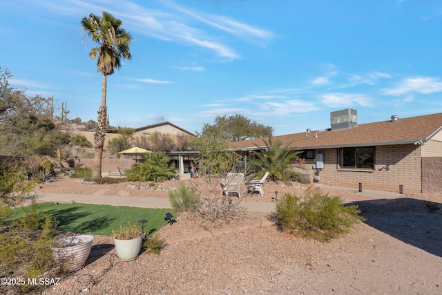 4921 N Boyd Ln, Tucson, AZ 85750 - view of front of property featuring brick siding, cooling unit, and a patio area