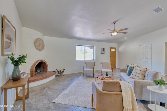 4921 N Boyd Ln, Tucson, AZ 85750 - living area with a ceiling fan, visible vents, vaulted ceiling, a brick fireplace, and baseboards