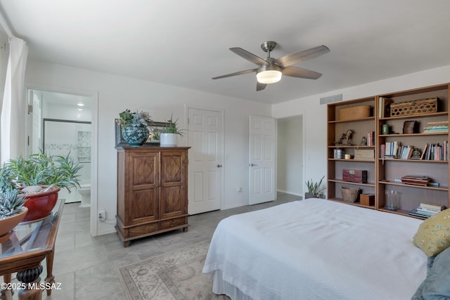 4921 N Boyd Ln, Tucson, AZ 85750 - bedroom with a ceiling fan, baseboards, visible vents, and ensuite bathroom