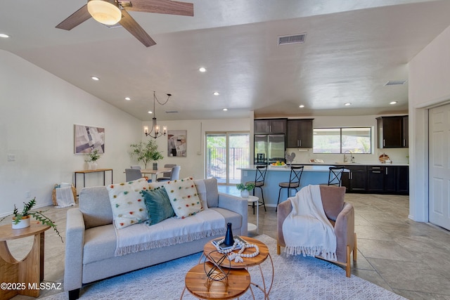4921 N Boyd Ln, Tucson, AZ 85750 - living room featuring recessed lighting, visible vents, lofted ceiling, and ceiling fan with notable chandelier