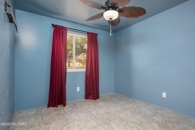 unfurnished room featuring a ceiling fan