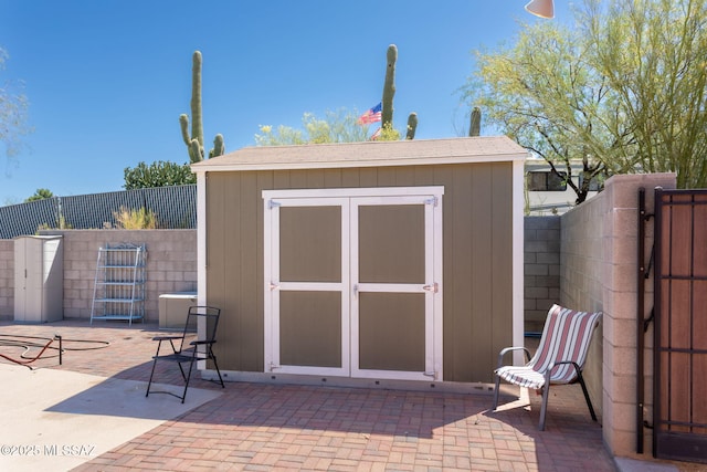 view of shed with a fenced backyard