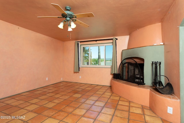 unfurnished living room with a ceiling fan