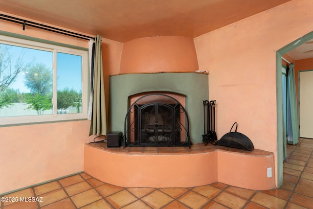 room details with a fireplace with raised hearth