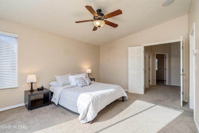 10261 N Wild Turkey Ln, Oro Valley, AZ 85737 - bedroom featuring baseboards, ceiling fan, vaulted ceiling, and light colored carpet