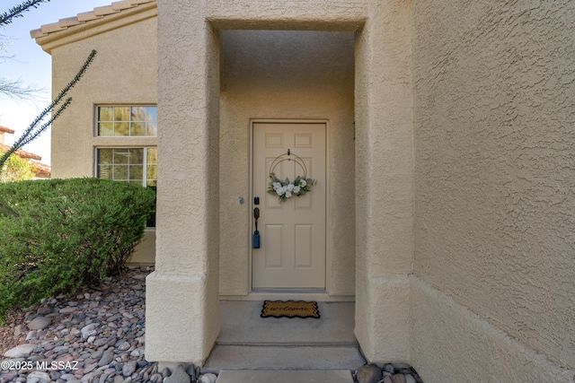 10261 N Wild Turkey Ln, Oro Valley, AZ 85737 - doorway to property with stucco siding