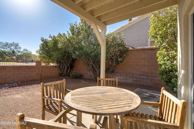 10261 N Wild Turkey Ln, Oro Valley, AZ 85737 - view of patio featuring outdoor dining area and a fenced backyard