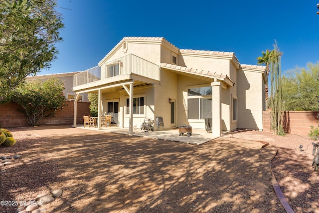 10261 N Wild Turkey Ln, Oro Valley, AZ 85737 - back of property featuring a balcony, a fenced backyard, stucco siding, a patio area, and a tile roof