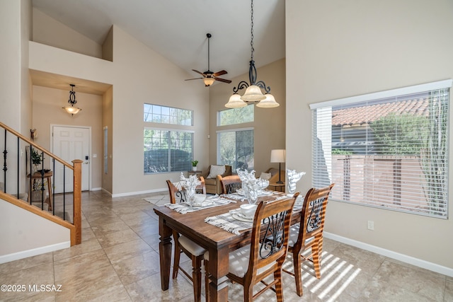 10261 N Wild Turkey Ln, Oro Valley, AZ 85737 - dining room with baseboards, ceiling fan, stairway, and high vaulted ceiling