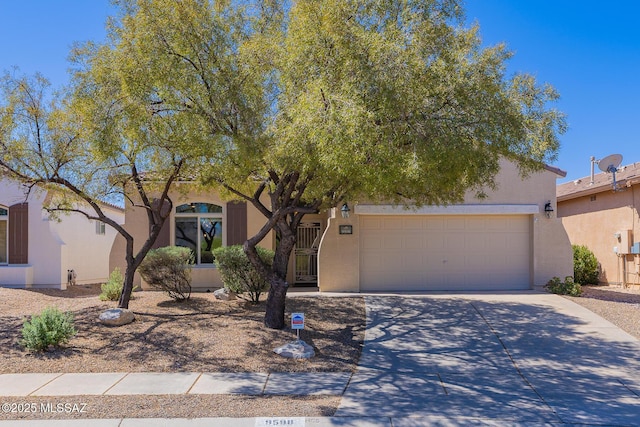view of property hidden behind natural elements with concrete driveway and stucco siding