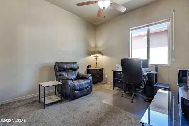 carpeted office with ceiling fan and baseboards