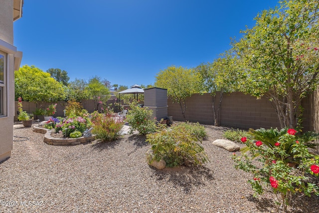 view of yard with a gazebo, a fenced backyard, and a patio