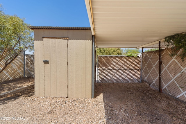 view of shed with a fenced backyard