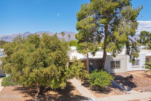 view of front of home featuring a mountain view