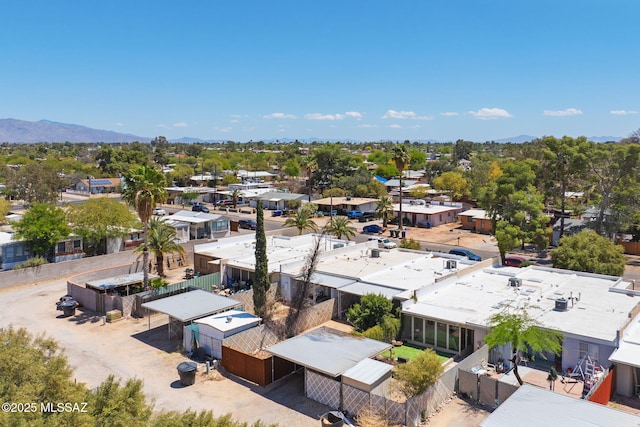 birds eye view of property with a mountain view