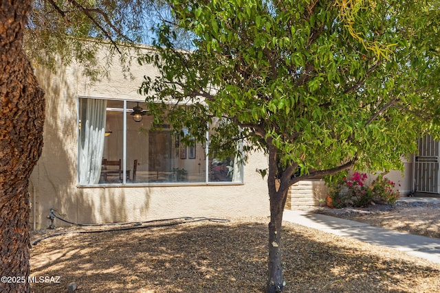 view of side of property featuring stucco siding