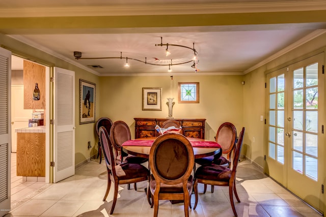 dining area with light tile patterned floors, baseboards, visible vents, and french doors