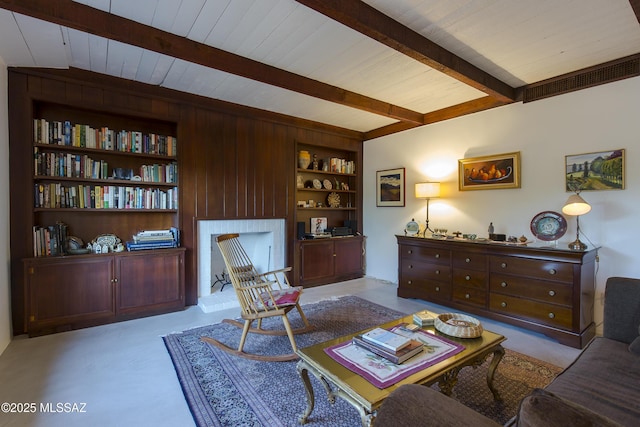 2626 E 4th St, Tucson, AZ 85716 - sitting room featuring wood ceiling, built in shelves, and beam ceiling