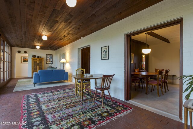 2626 E 4th St, Tucson, AZ 85716 - interior space featuring wooden ceiling and brick floor
