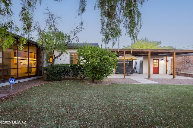 2626 E 4th St, Tucson, AZ 85716 - rear view of house featuring stucco siding, a yard, and a patio area