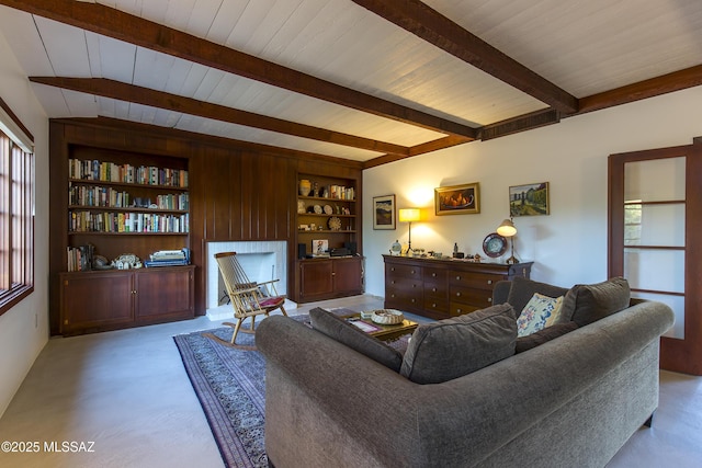 2626 E 4th St, Tucson, AZ 85716 - living area featuring wood ceiling, beam ceiling, and built in shelves