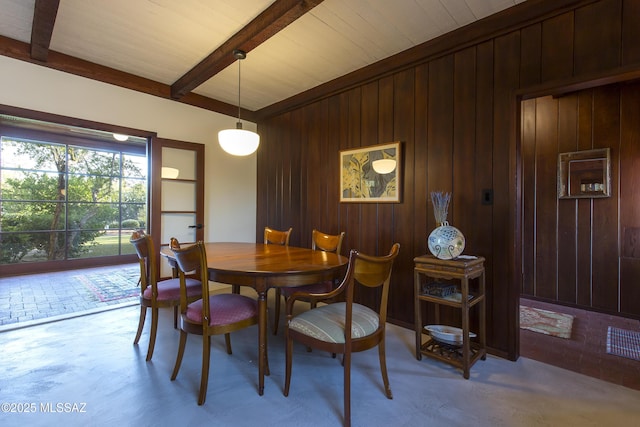 2626 E 4th St, Tucson, AZ 85716 - dining space featuring wooden walls and lofted ceiling with beams
