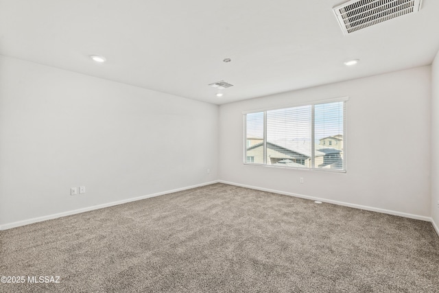 carpeted empty room with recessed lighting, baseboards, and visible vents