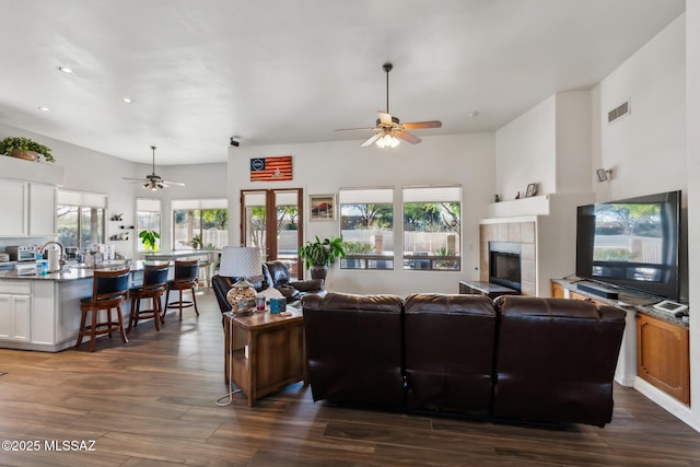 13960 E Placita Simpatica, Vail, AZ 85641 - living area featuring ceiling fan, dark wood-style floors, recessed lighting, and a fireplace