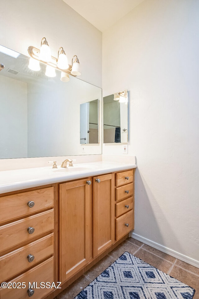 13960 E Placita Simpatica, Vail, AZ 85641 - bathroom featuring vanity, baseboards, and tile patterned flooring