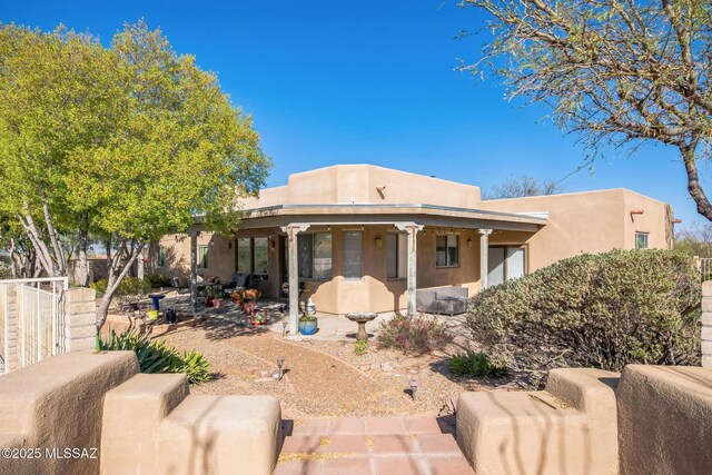 13960 E Placita Simpatica, Vail, AZ 85641 - adobe home with driveway, a garage, and stucco siding