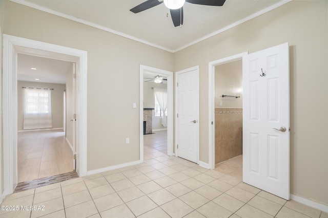 1025 N Perry Ave, Tucson, AZ 85705 - unfurnished room with ornamental molding, ceiling fan, and light tile patterned flooring