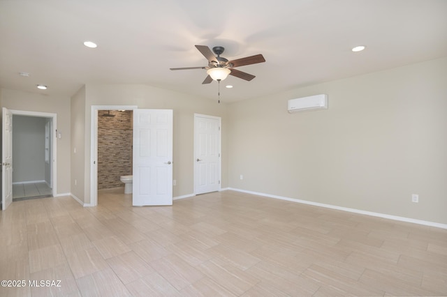 1025 N Perry Ave, Tucson, AZ 85705 - interior space featuring baseboards, recessed lighting, a wall unit AC, and light wood-type flooring
