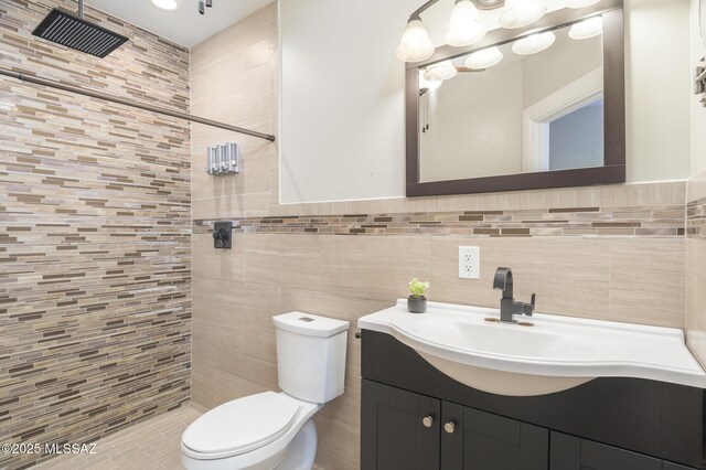 1025 N Perry Ave, Tucson, AZ 85705 - bathroom featuring tile walls, a tile shower, toilet, and vanity