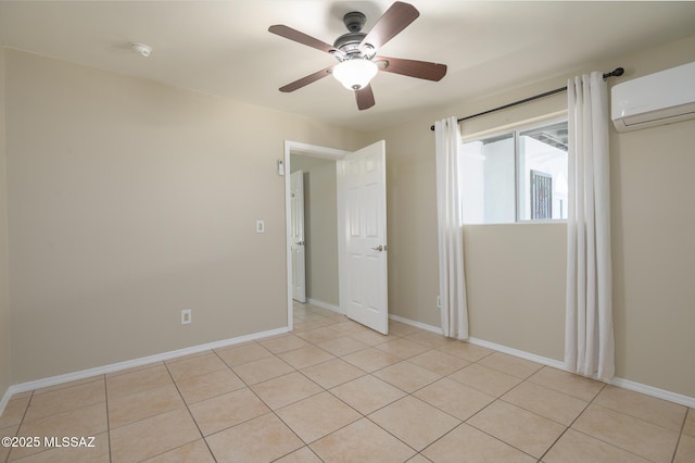 1025 N Perry Ave, Tucson, AZ 85705 - unfurnished room featuring a wall mounted air conditioner, a ceiling fan, light tile patterned flooring, and baseboards