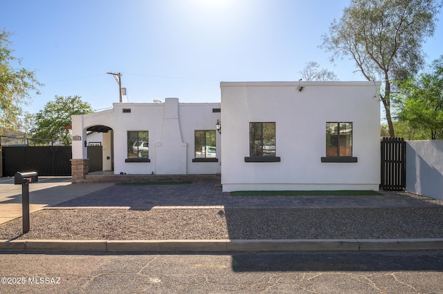 1025 N Perry Ave, Tucson, AZ 85705 - view of front of house with stucco siding and fence