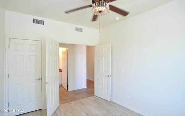 8573 N Western Juniper Ter, Tucson, AZ 85743 - unfurnished room featuring baseboards, ceiling fan, light wood-type flooring, and visible vents